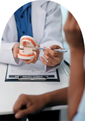 beyondental dentist explaining the dental treatment to the patient using a teeth model